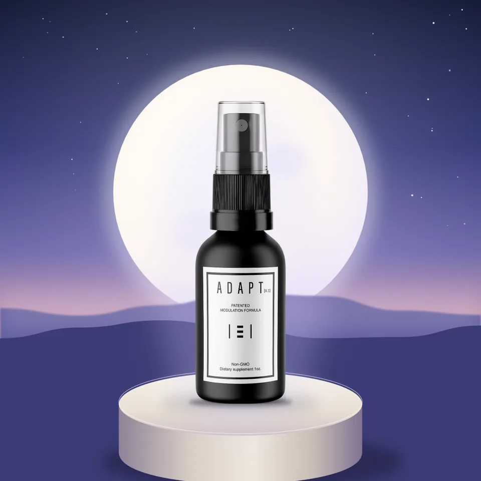 Adapt X.1 bottle on a pedestal in front of a rising moon